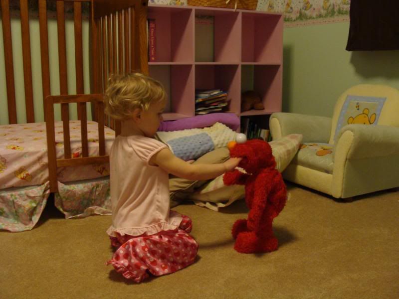 Checking out Elmo's mouth