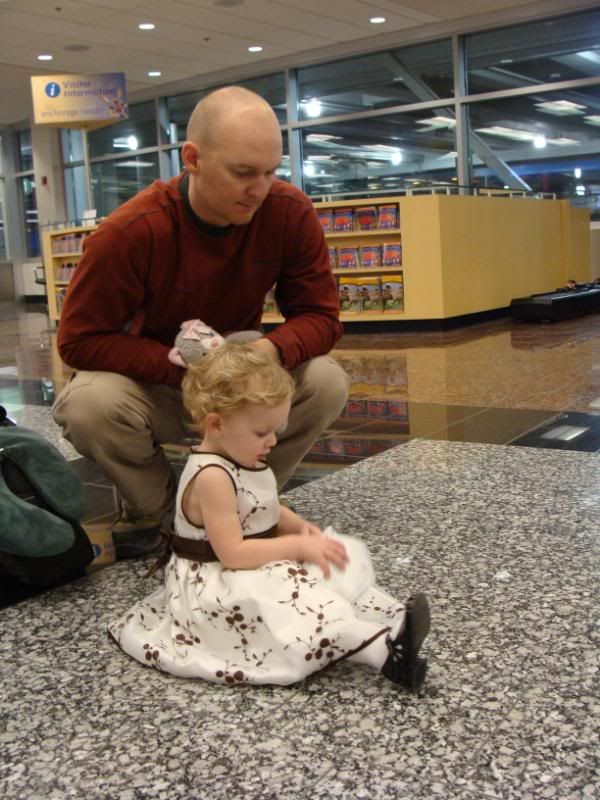 Showing daddy the contents of her purse