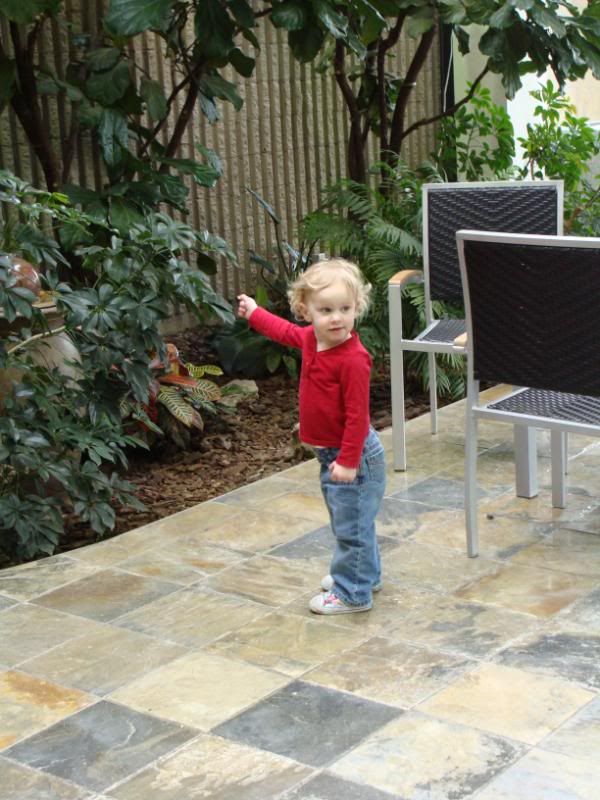 What is she pointing at?