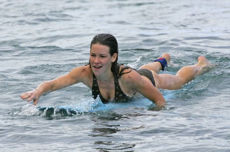  more Evangeline Lilly pictures in her bikini and successfully surfing
