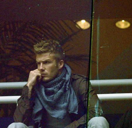 David Beckham gave photographers a peak of his new sleeve while sitting in 